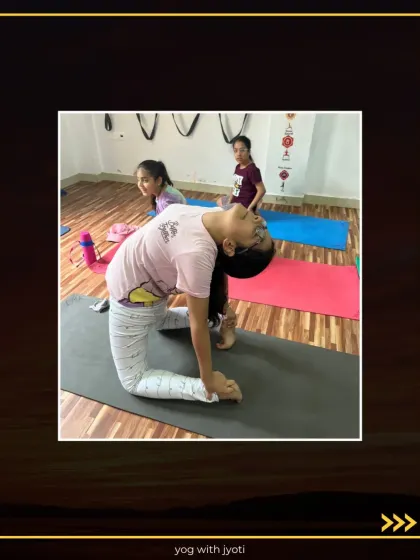 A group of young girls practicing Ustrasana together, supporting each other's journey in flexibility and strength.