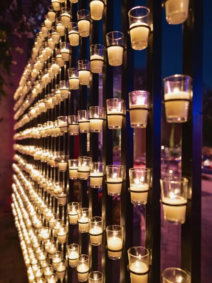 A wall of candles created a stunning, glowing backdrop for photos and added to the romantic, magical ambiance of the Sangeet in Marrakech.