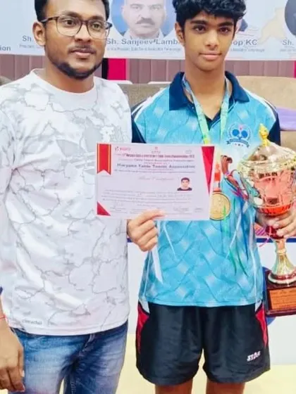 A close-up of our champion with his trophy and certificate from the Haryana Table Tennis Association. These moments are what we train for every single day.