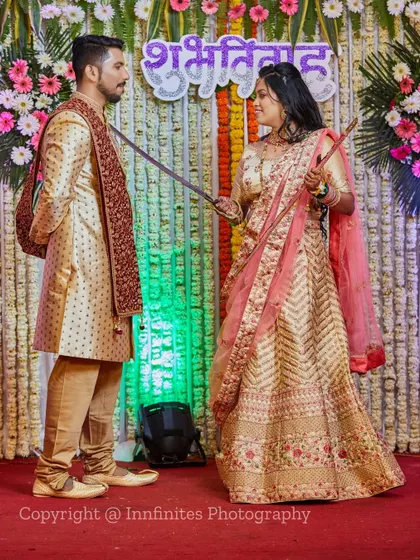 I love when couples want to have fun with their photos. This playful, staged shot with a sword adds a touch of humor and personality to their wedding album.