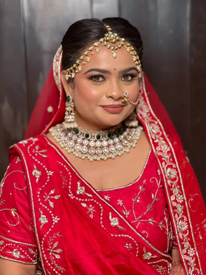 A smiling portrait of the bride, looking happy and confident.