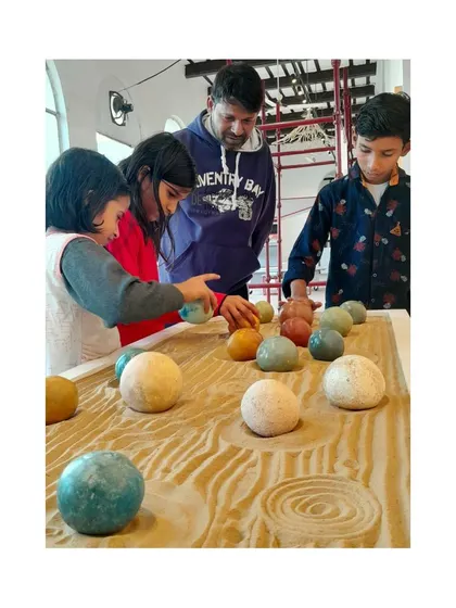 Visitors of all ages interacting with our Tadelakt spheres at the biennale. We believe in hands-on experiences to share our love for natural materials.