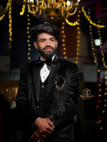 A dapper guest looking sharp in a black velvet tuxedo. We capture stylish portraits of not just the groom, but his closest friends and family as well.