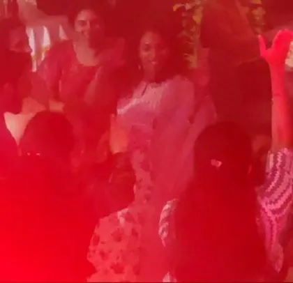A corporate sales meet for Lagoon, with the party lit in red.