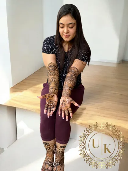This bride is showcasing her complete bridal mehandi, with detailed designs on both her hands and feet. I love creating these full, traditional looks for the big day.