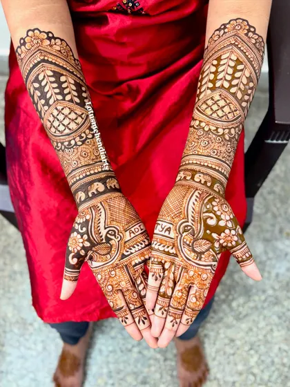 A beautiful bridal design featuring peacocks and personalized initials 'Aditya', created with my signature organic henna.
