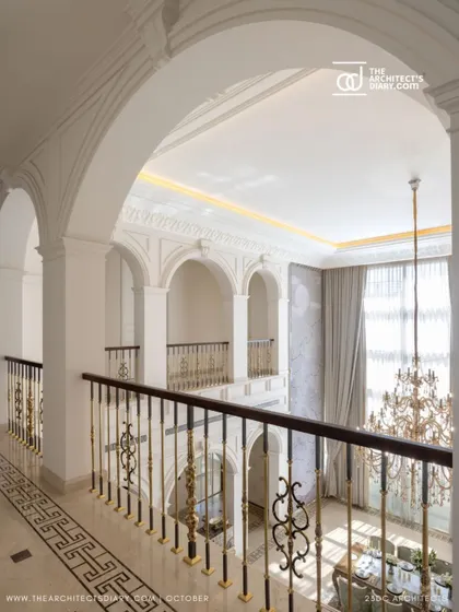 Another perspective of the upper corridor in The Ivory Royale, showcasing the beautiful classical arches and the view into the grand living space below. The design creates a sense of layered space and visual connection.