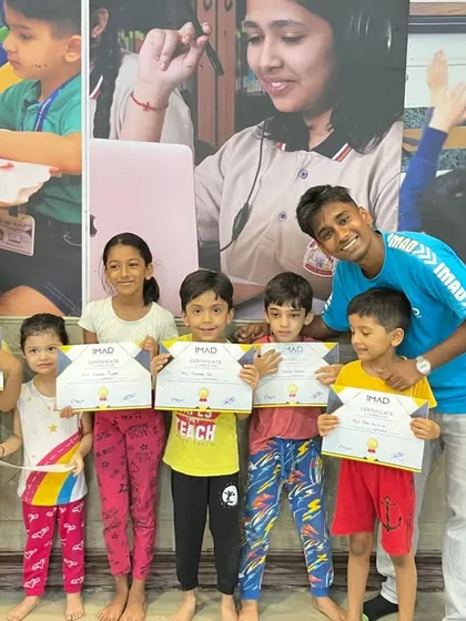 More happy graduates from our 2025 summer camp, posing with their certificates and their instructor.
