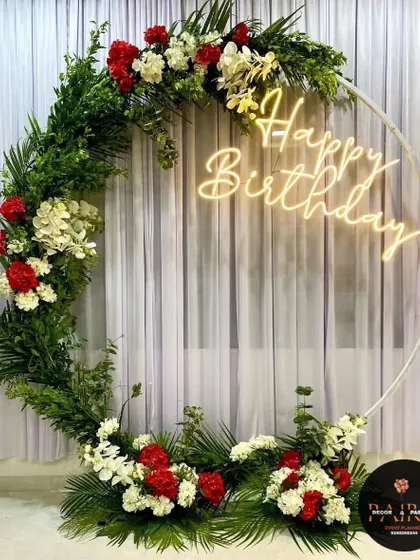 A unique birthday ring made with fresh greenery and flowers, offering a natural and beautiful alternative to balloons.