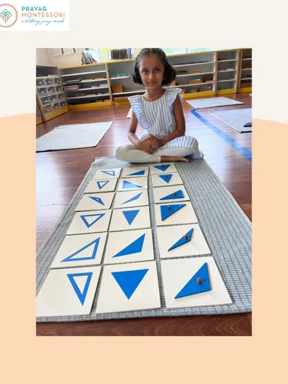 Working with the triangle drawer of the Geometry Cabinet, this student is learning to distinguish between scalene, isosceles, and equilateral triangles.