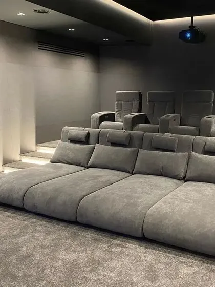 This seating arrangement features a large, comfortable daybed in the front row, perfect for kids or for anyone who wants to lie down and relax during a movie.