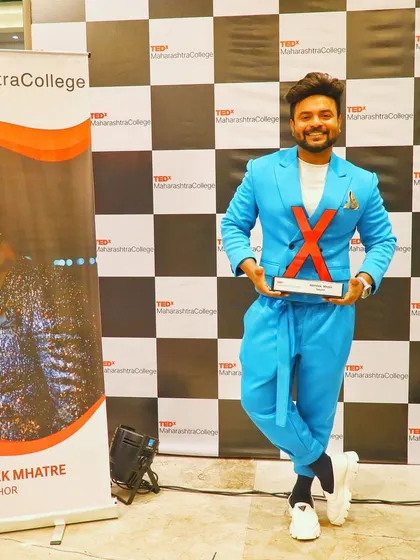 A proud moment, holding my TEDx award.