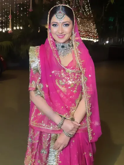 A portrait of Trish's stunning Rajasthani look. The makeup is soft yet defined, allowing the magnificent jewelry and traditional outfit to take center stage.