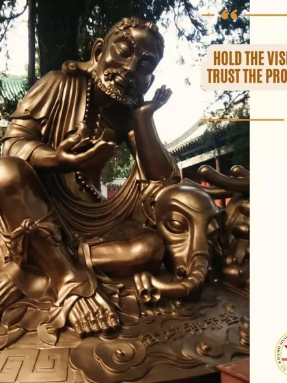 A statue of Bodhidharma, the patriarch of Zen Buddhism and Shaolin Kung Fu. His teachings emphasize that true skill comes from discipline and trusting the process of repetition.