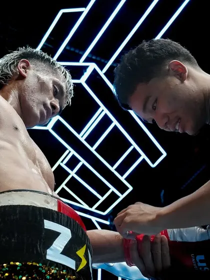 A wholesome moment of brotherhood. Two fighters, brothers in arms, sharing a moment of support in the corner between rounds.