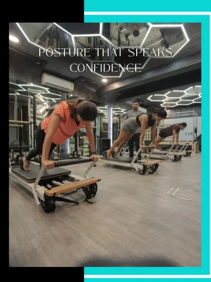 This image highlights how Pilates improves posture. The clients maintain a straight spine while performing a difficult exercise, building the muscles needed for confident, upright posture in daily life.