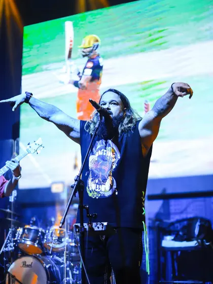 Arms wide open, embracing the energy of the crowd. This is the connection we build during every live performance.
