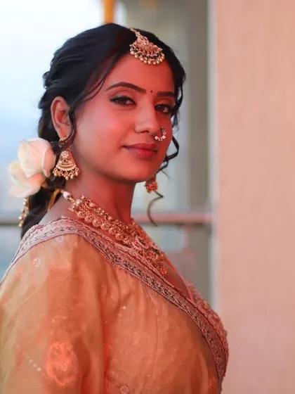 A side profile showcasing the beautiful braided hairstyle adorned with a white rose. This demonstrates my attention to detail in creating a complete, 360-degree look.