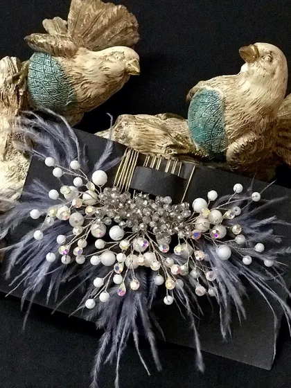 For a more modern and chic look, I love this grey feather comb. The iridescent crystals add a beautiful sparkle.
