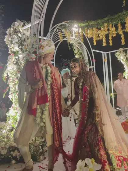 A candid, joyful moment between the bride and groom. Our goal is to manage the entertainment so you can relax and enjoy these precious, unscripted parts of your wedding day.