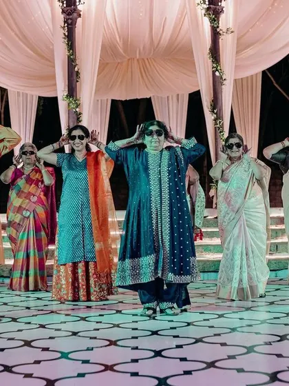 The stars of the night! The family steals the show with a fun dance performance on the custom-printed dance floor of this elegant sangeet.