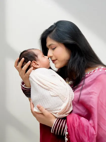 A mother holds her newborn close, their noses touching in a moment of pure connection. These are the simple, beautiful memories I love to capture.