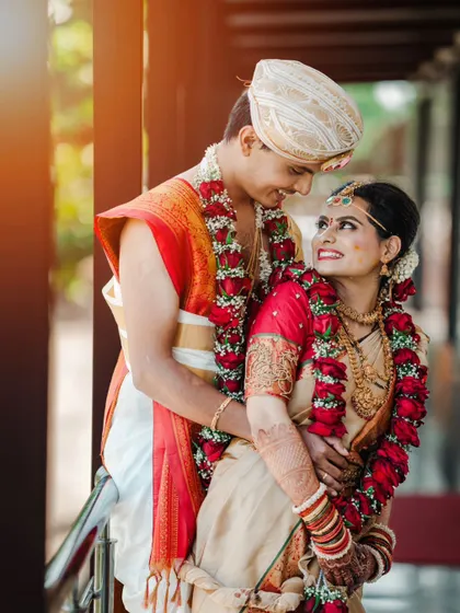A beautiful, sun-kissed portrait of a newly married couple, their love shining as brightly as the light.