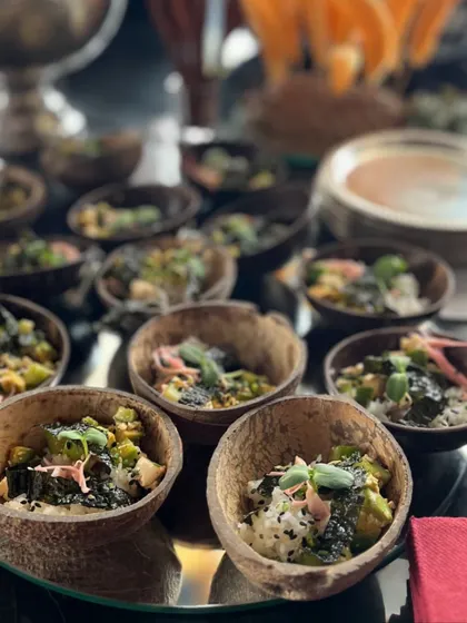 Poke bowls served in eco-friendly coconut shells. This dish is a healthy and trendy option, perfect for brand launches and modern events, showcasing our diverse culinary range.