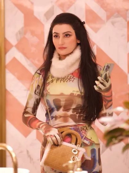 Even a Yeti needs a phone. A fun, candid moment from the set of 'Fabulous Lives'.