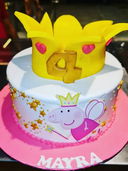 A royal treat for a little one's birthday, this Peppa Pig cake features a fairy Peppa and a large, edible golden crown topper.