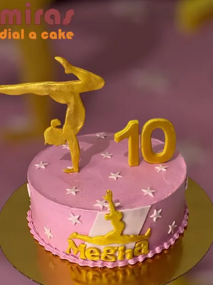 A graceful and elegant cake for a gymnast or yoga lover. The pink cake is adorned with golden silhouettes in gymnastic poses, celebrating strength and flexibility.