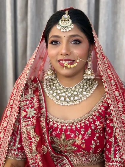 A classic bridal portrait. The makeup is timeless, with a focus on flawless skin and expressive eyes.