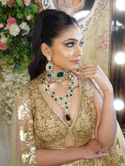 Another angle of the glam look, showing the model's confident pose and the beautiful details of the jewellery.