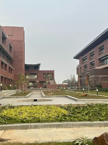 A landscaped court at Azim Premji University, providing a quiet, green space for students to relax and study between classes. The design is inspired by the climate-responsive courtyards of the region.