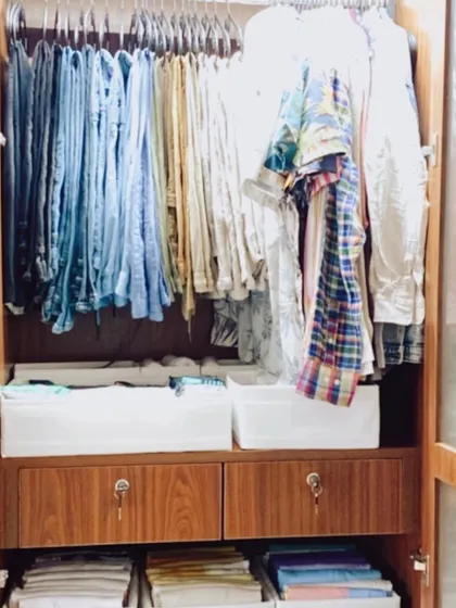 Another example of using bins on shelves to create "drawers". This is a key strategy we use to maximize storage in wardrobes without built-in drawers.