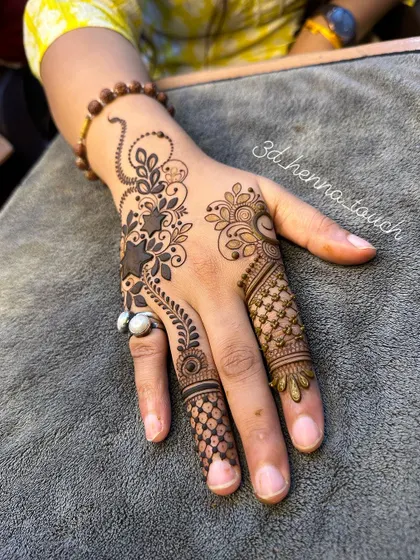 A modern and edgy design featuring stars and vines. This is a great choice for someone who wants a non-traditional henna look.