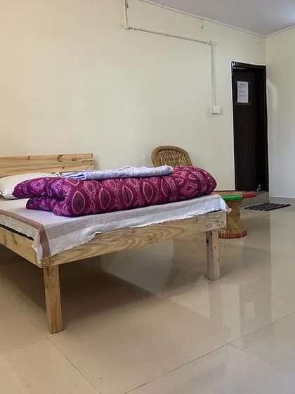 A look inside one of the clean and simple rooms for our students. We provide a comfortable and sattvic environment to support your studies.