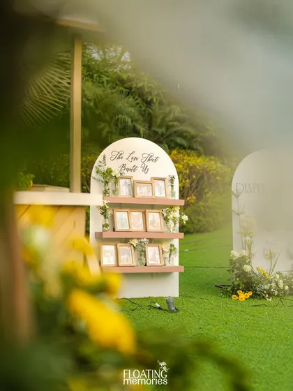 We created special displays for personal photos, like this arched shelving unit that showcases 'The Love That Built Us'. It's a sweet, sentimental touch that we love incorporating into our events.