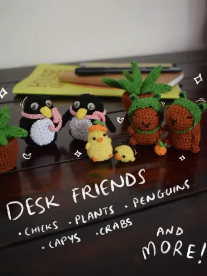 A whole crew of desk friends ready to keep you company! This little gang includes my crochet capybaras, penguins, potted plants, and chicks. They are the perfect, no-fuss companions for your workspace.