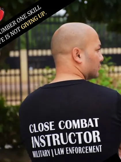 A shot of my back, wearing a "Close Combat Instructor" T-shirt for Military and Law Enforcement. The number one skill I teach is to never give up.