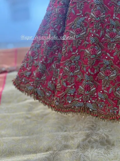 A close-up of the sleeve cuff with bead tassels.