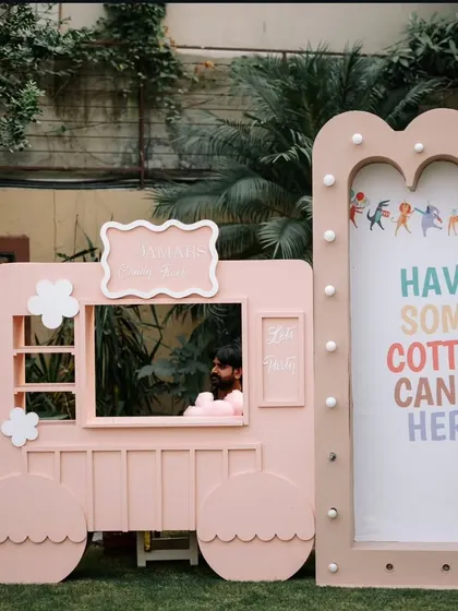 A custom-designed pastel pink cotton candy truck, adding a fun and interactive food station that perfectly matched the party's aesthetic.