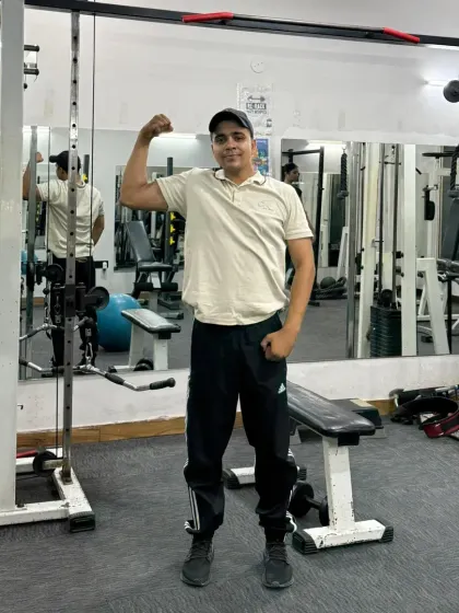 Standing bicep pose.