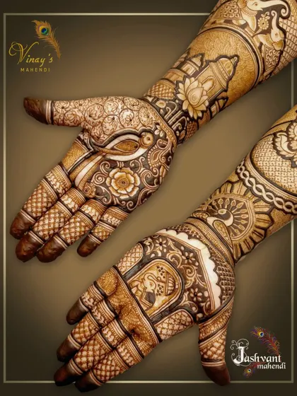 A dynamic shot of the groom's sister's mehndi, showing both hands to highlight the beautiful asymmetry of the design.