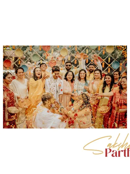 The whole family joins in for the "phoolon ki haldi." This shot, with everyone showering the couple in petals, is a beautiful representation of the love and blessings surrounding them.