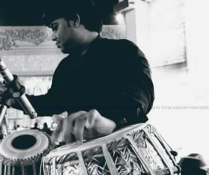 A black and white photograph capturing a moment of deep concentration during a performance. For me, every note is a form of expression, and this image reflects the complete immersion I feel when I play.