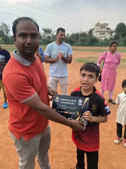 Celebrating effort and performance at our Under 12 match. A young player receives a certificate of appreciation, reinforcing our belief that every contribution matters.