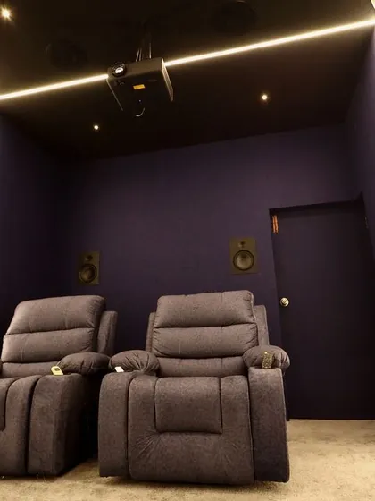 A clear view of the two-seater recliner setup, perfect for a couple's movie night.