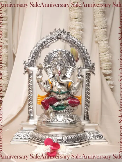 A majestic silver Panchmukhi Ganesha idol, seated under an ornate arch. This powerful form of Lord Ganesha is believed to bring blessings and remove obstacles, making it a cherished piece for any home.