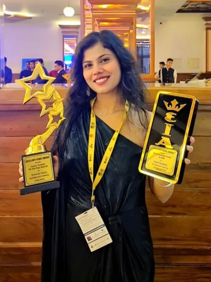 Another shot from the awards night, holding two of the trophies we were honored with. Each one represents a milestone in our journey and a promise to our students to always deliver our best.
